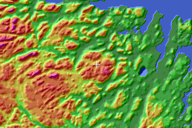 A circular batholith intrusion at the centre of the colour shaded relief image